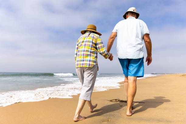 istock Couple Enjoying a Vacation Day at the Beach 1422086914