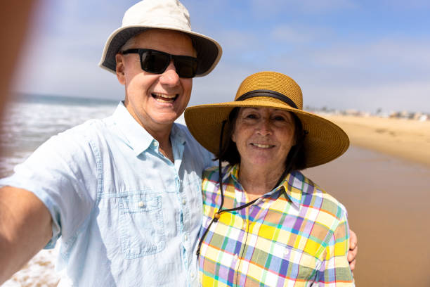 istock Couple Enjoying a Vacation Day at the Beach 1422087692