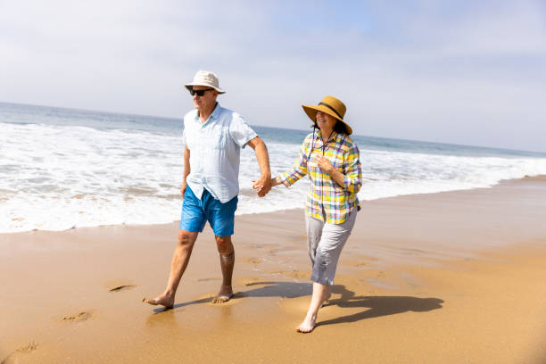 istock Couple Enjoying a Vacation Day at the Beach 1422087729