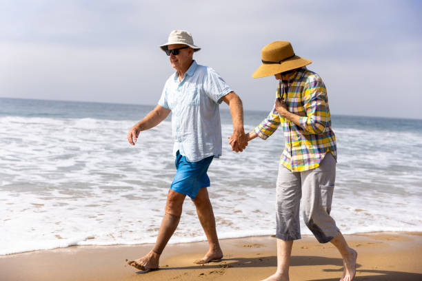istock Couple Enjoying a Vacation Day at the Beach 1422087736