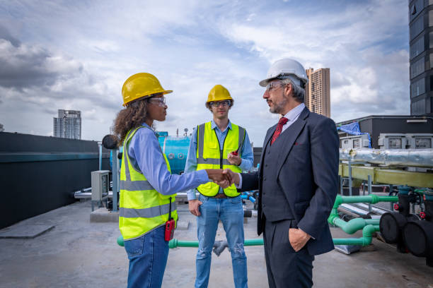 istock Manager and engineers handshake greeting or congratulate when work done or deal to working is successful is teamwork industry concept. 1422089540