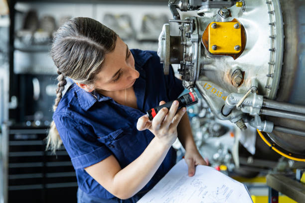 istock Real life young female aircraft engineer apprentice at work 1422090277