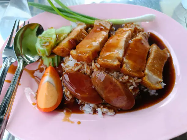 Photo of crispy pork belly on topped rice,  Asian thai food style popular