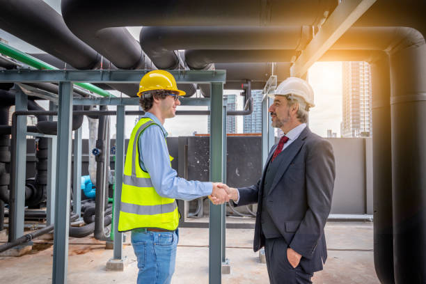 istock Manager and engineers handshake greeting or congratulate when work done or deal to working is successful is teamwork industry concept. 1422090346
