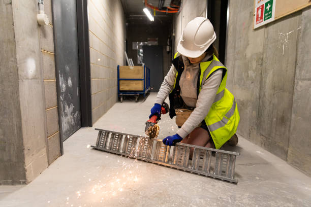 istock Real life female electrician at work 1422098852