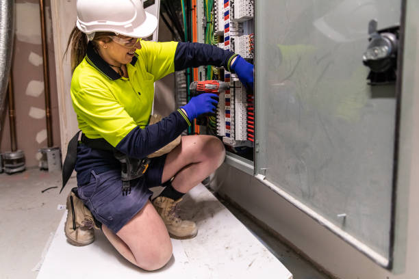 istock Real life female electrician at work 1422098991