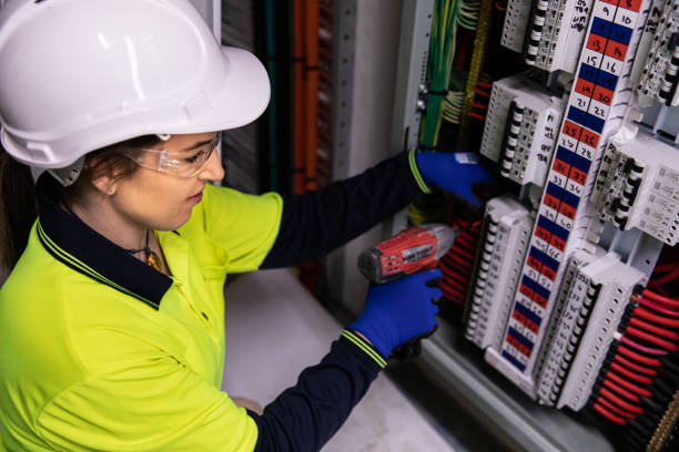 Real life female electrician at work