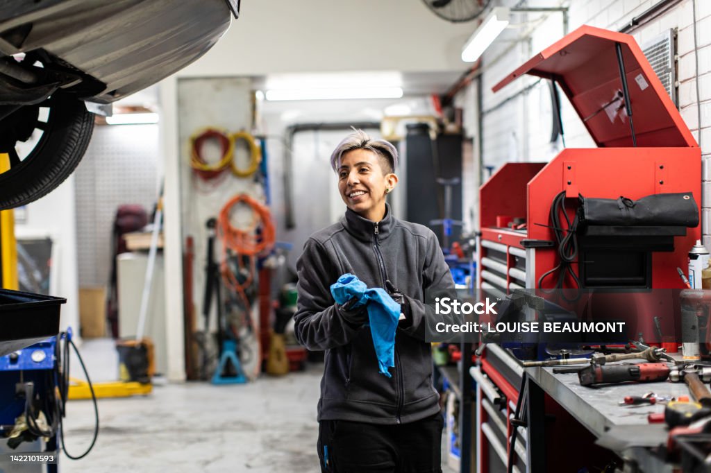 Real life female mechanic at work Lady tradie Australia Stock Photo