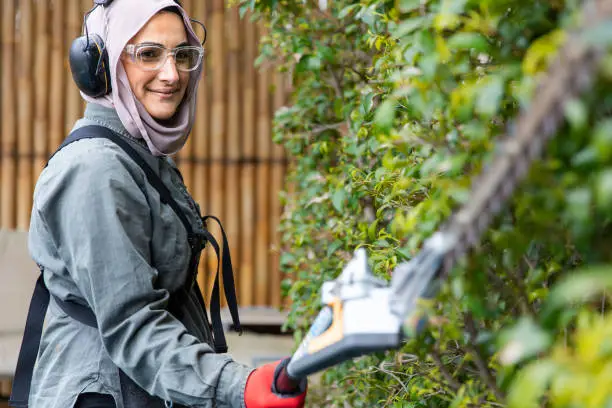 Photo of Real life female tradie working in her own landscaping business