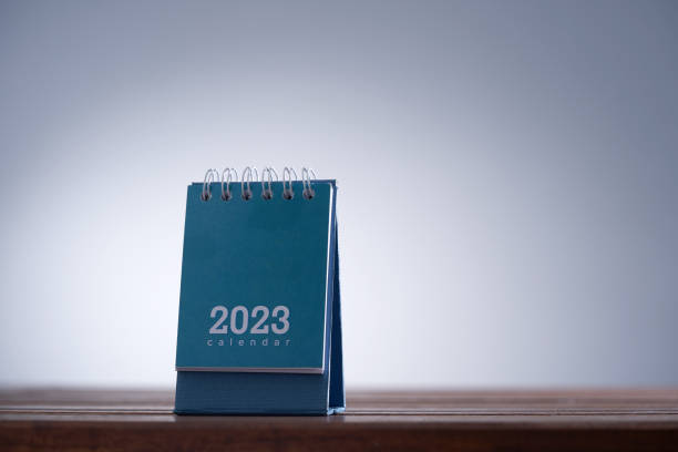 istock blue small desk calendatr on wood table with copy space 1422103435