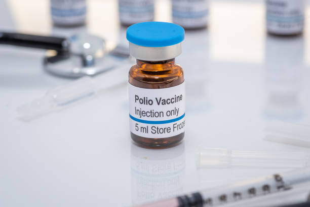 istock Polio vaccine vials with syringe and stethoscope 1422104845