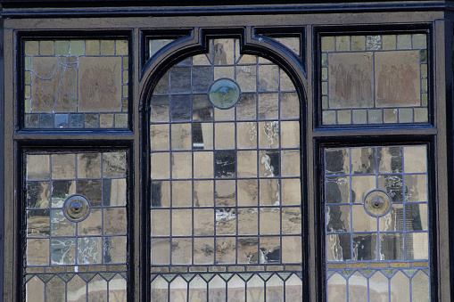 detail of leaded window with reflected light