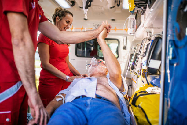 istock happy ambulance staf with the patient after successful assistance 1422107010