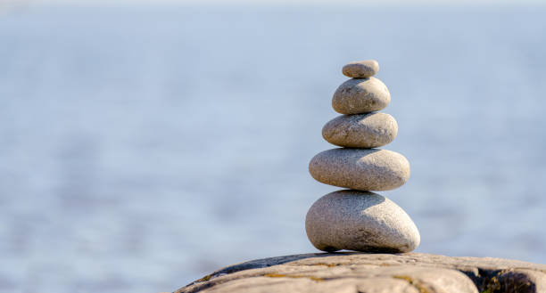 istock Pyramid of stones. Unstable balance of stone objects. 1422107166