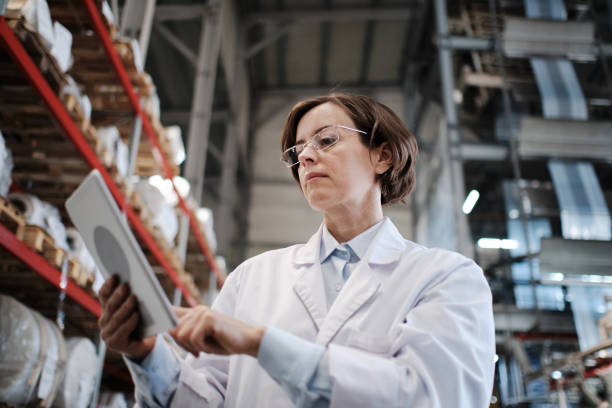 istock Female worker using tablet at the factory 1422108144