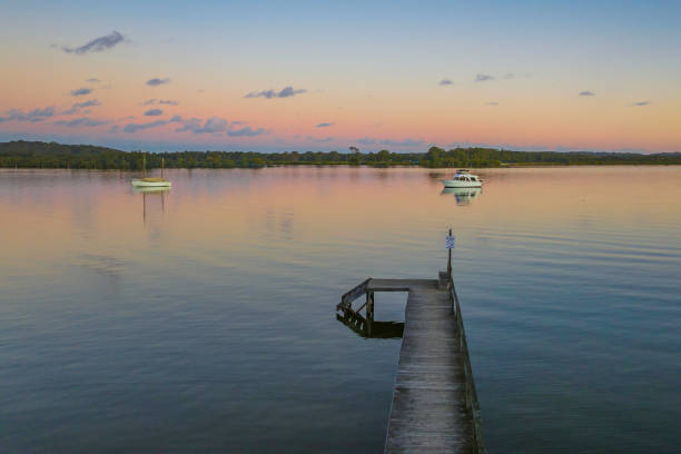 istock Sunset over the river with boats 1422109543