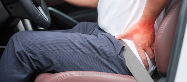man with his back sprain while driving car long time, back body ache due to Piriformis Syndrome, Low Back Pain and Spinal Compression. Ergonomic and medical concept