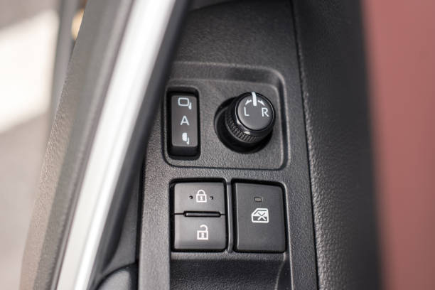 istock buttons controlling the windows inside a car, control and electric mirror adjustment 1422110965