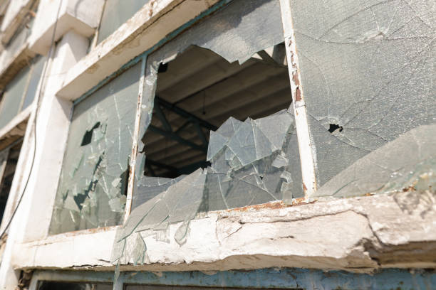 istock Broken walls and windows in an abandoned industrial building. 1422115216