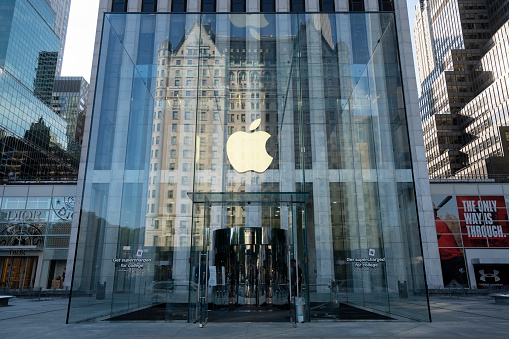 New York, NY, USA - July 9, 2022: Front view of the Apple flagship store on the Fifth Avenue in NYC. Apple, Inc. is an American multinational technology company headquartered in Cupertino, California.