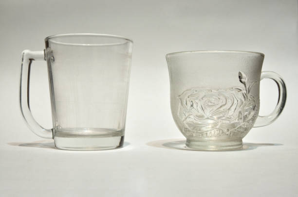 istock Empty cups, Two used glasses on white background, Transparent glass 1422116402