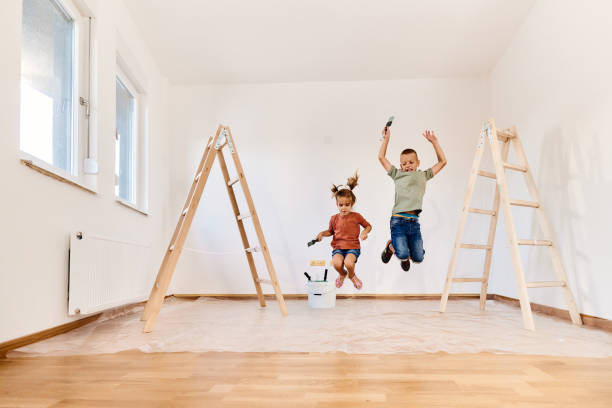 istock Playful kids jumping during home renovation process. 1422119866