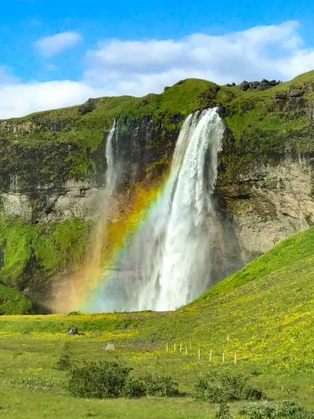 Photo of Seljalandsfoss Waterfall with rainbow no people Southern Iceland