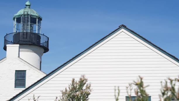 istock Vintage lighthouse tower, retro light house, old fashioned classic white beacon. 1422120267