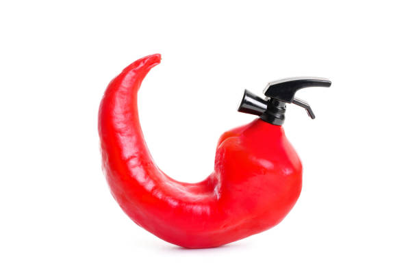 istock Chili pepper shaped fire extinguisher on white 1422121447