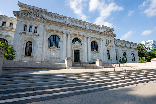 Washington, DC, USA - June 24, 2022: Exterior view of the restored Beaux-Arts style Apple Carnegie Library on Mount Vernon Square, which was once home to Washington, D.C.’s Central Public Library.