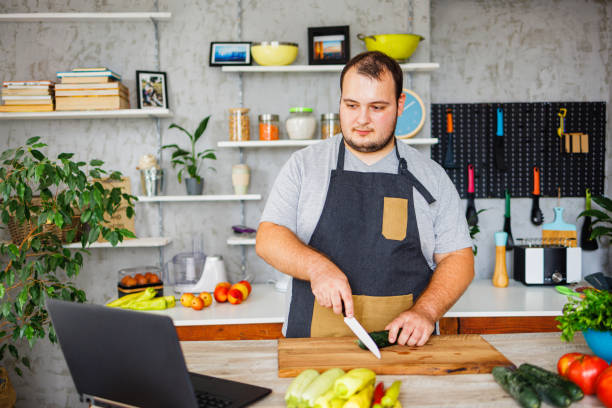 istock Man learning how to cook healthy food 1422122282