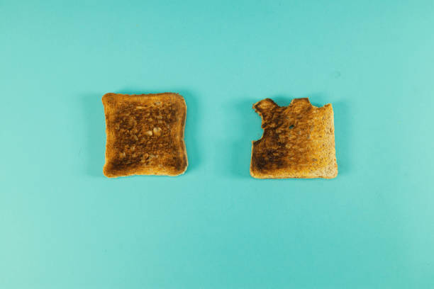 istock Concept of uniqueness toasted bread and fresh one. 1422124241