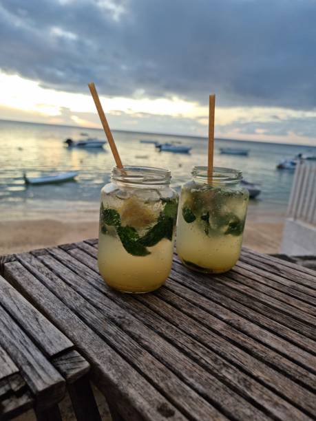 istock Summer fresh cocktails with blur beach on background. 1422125172