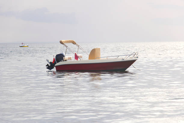 istock motorboat at sea, ocean, sunset 1422125374