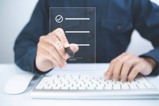 istock Businessman, work from home, handling documents, E-signing, signing digital contracts electronic signing electronic signature through internet technology document data management smart contract 1422125656