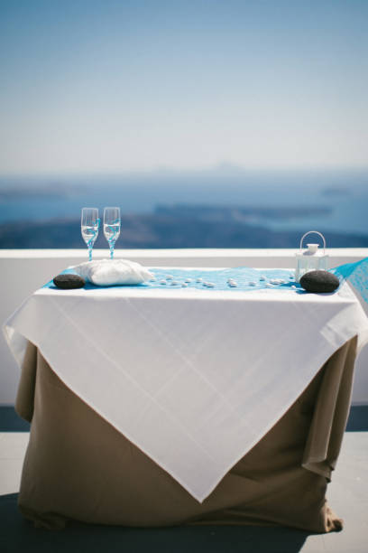 istock Two wedding champagne glasses on the table 1422127358