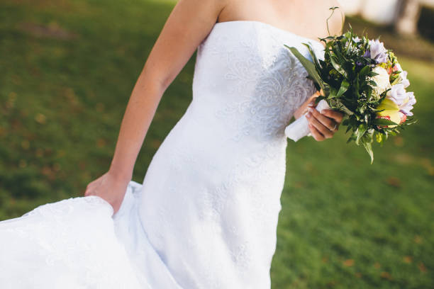 istock Bright wedding bouquet in hands of the bride 1422127511