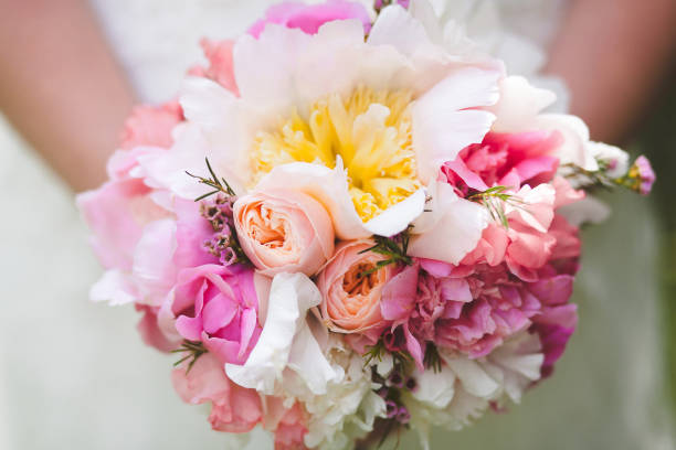 istock Bright wedding bouquet in hands of the bride 1422127592
