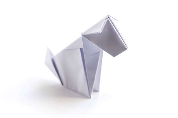 Paper dog origami isolated on a white background stock photo