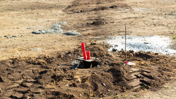 istock A red plastic pipe sticking out of the ground is an irrigation system 1422133624
