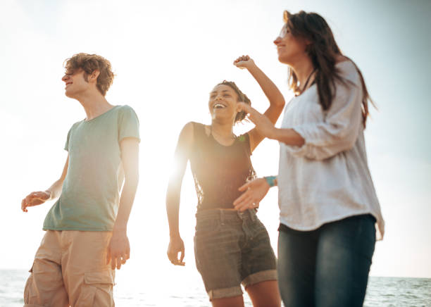 istock friends dancing at the beach party 1422135743