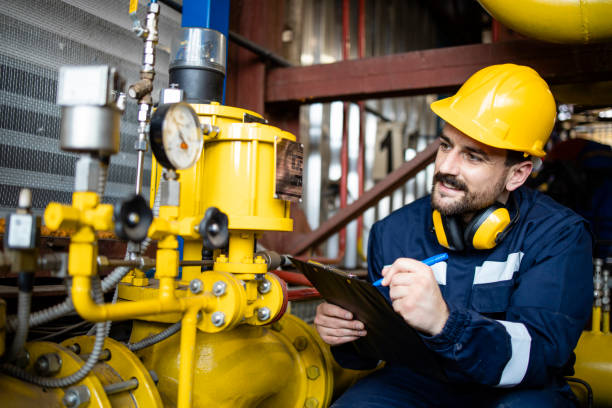 Working in natural gas refinery plant checking supply and distribution. stock photo