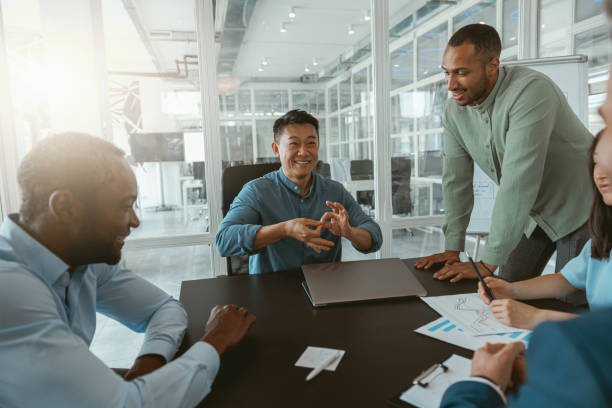 istock Group of multiethnic business people working together on project while sitting in modern office 1422139982