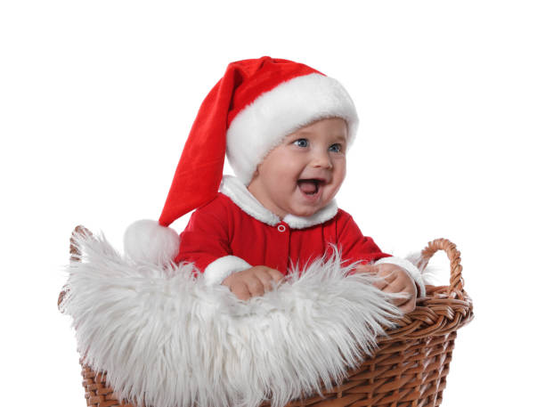 istock Cute baby in wicker basket on white background. Christmas celebration 1422142121