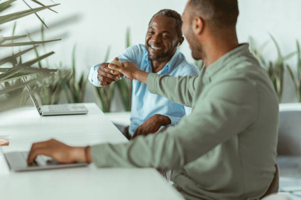 istock Two african business colleagues working together in modern office 1422143719