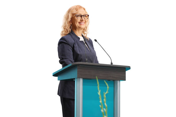 istock Woman smiling and standing on a speaker stand 1422144572