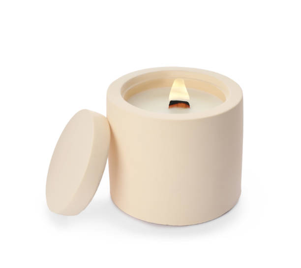 istock Aromatic soy candle with wooden wick isolated on white 1422150269