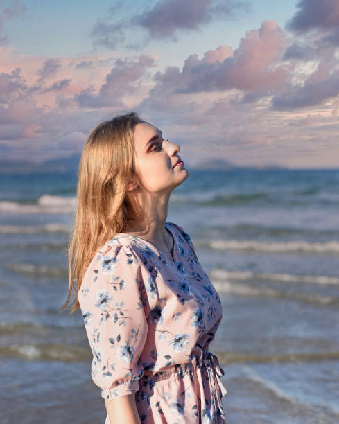 istock Beautiful Belarus woman walking on the beach against dramatic and romantic sky 1422165437