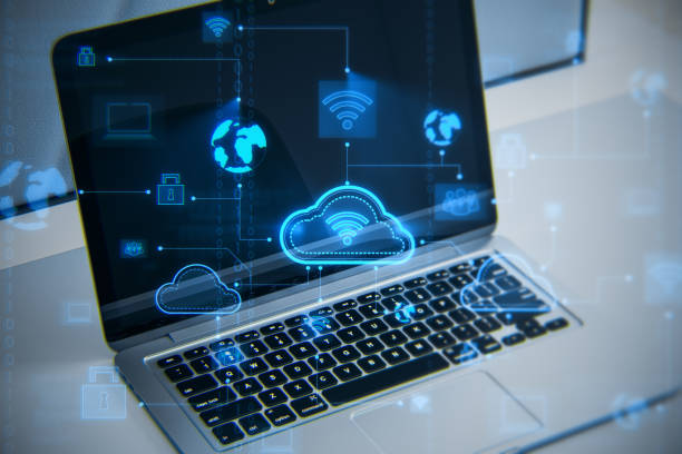istock Close up of laptop computer at workplace with creative digital cloud computing hologram on blurry background. Cloud data and service concept. 3D Rendering. 1422168636