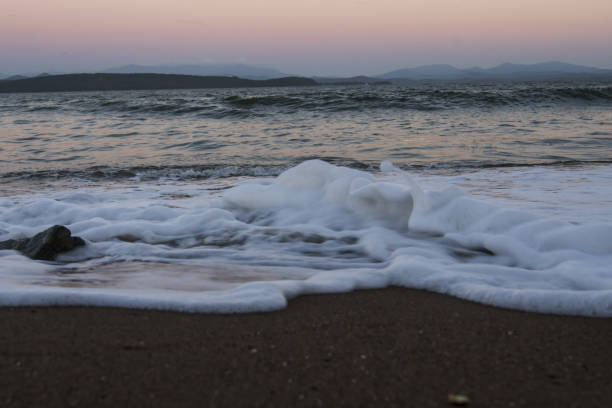 istock sand and waves on the sea 1422170273